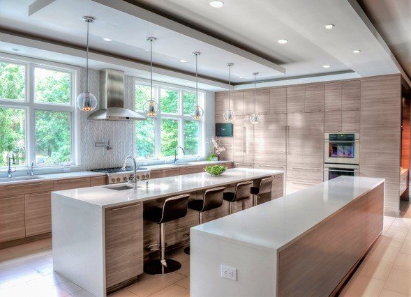 Dual island kitchen with lots of windows, pendant lights, lots of windows and seating for four