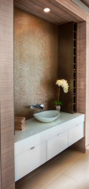 White floating vanity with white vessel sink and orchid
