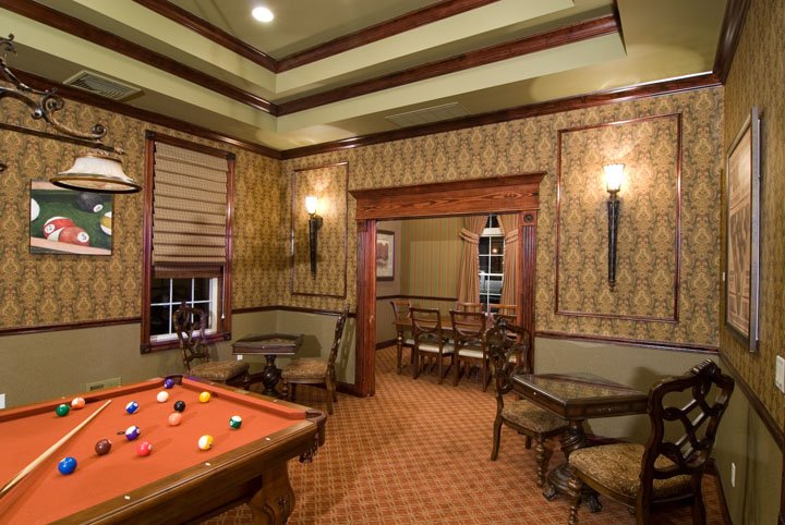 Billiard room with pool table and tables and chairs