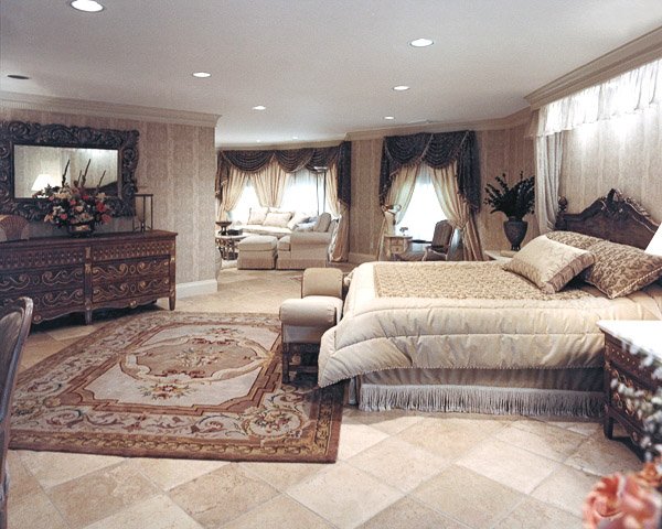 Bedroom with a bed, wood dresser and area rug