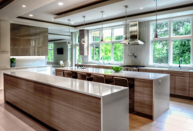 Interior Design Staten Island kitchen with two islands, wood cabinetry and large windows