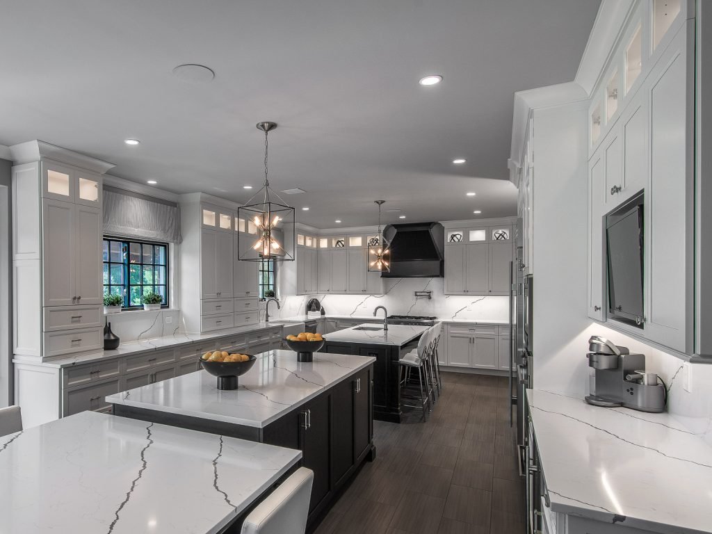 Kitchen with double island and white cabinets